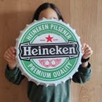 Wandbord met flesdop Heineken - Reclamebord -
