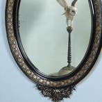 Ovale spiegel in zwart met zilver bekroond door cupido met p, Ophalen of Verzenden