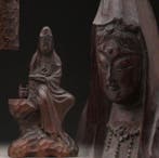 Kannon Bodhisattva wearing white robes and holding a