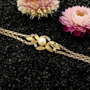 8 karaat florale armband met parel en zirconia, Gebruikt, Geel, Ophalen of Verzenden, Met edelsteen