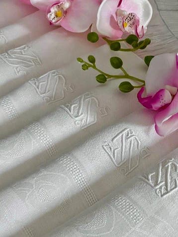 ** Tafelkleed met tien linnen servetten met art-deco-rozen,