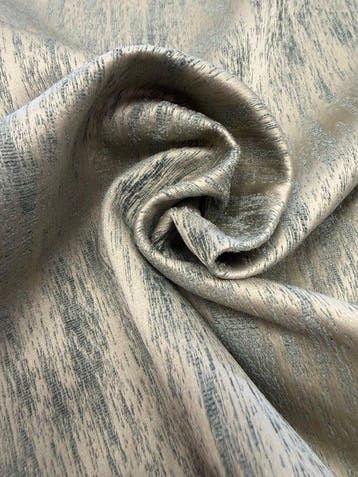 Elegante en scenografische stof met een abstract ontwerp dat