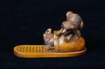 Absolute veiling - gesigneerd Gyokuzan boxhout netsuke