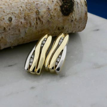 Bicolor gouden oorstekers met diamanten; 0,16 ct., Sieraden, Tassen en Uiterlijk, Gebruikt, Ophalen of Verzenden, Met edelsteen