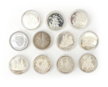 11 zilveren munten wo. Liberiaanse Dollars en Ghanese Sika