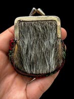 Curieuze en wilde kleine tas of portemonnee van traditioneel