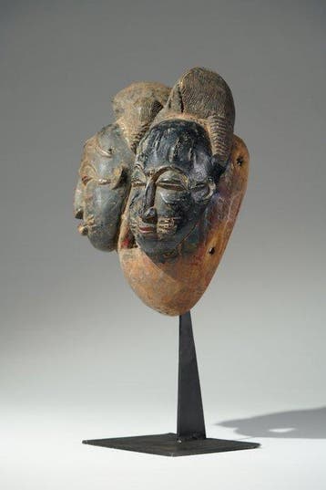 Een houten masker - Geheimhoudingsovereenkomst - Baule -
