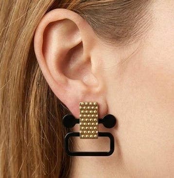 Alessi - staal, gecoat met hypoallergeen PVD, goud en zwart.