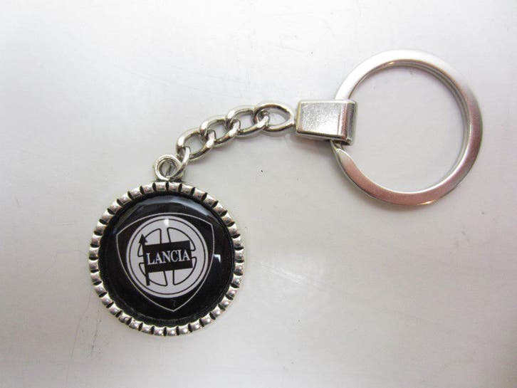 Sleutelhanger Lancia metaal ribbel rond zwart -NIEUW-, Verzamelen, Sleutelhangers, Verzenden