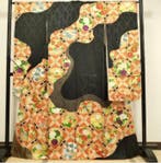 Zwarte en oranje kimono met geometrisch bloemmotief en