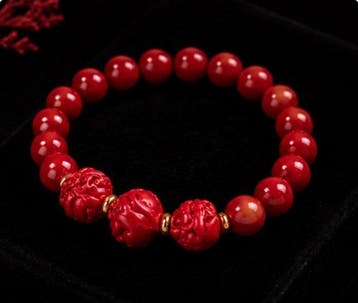 Koraalarmband met centrale kralen van de Chinese dierenriem:
