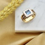 Bicolor gouden ring met topaas en diamanten; 0,12 ct., Gebruikt, Overige kleuren, Ophalen of Verzenden, 17 tot 18