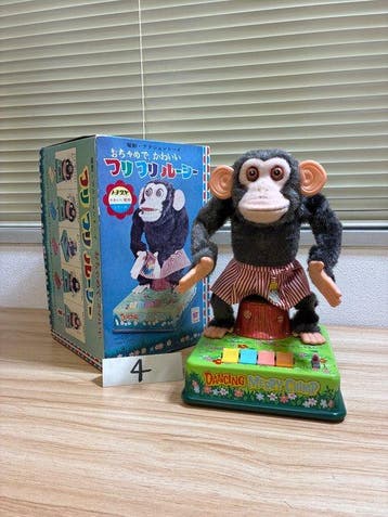 CK - Speelgoed CK “Furifuri Lucy” Dancing Merry Chimp Tin