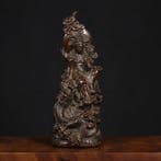 A rare antique brass statue of Guanyin Bodhisattva seated on