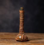 Oud-Romeins glas gewikkeld in textiel met Spaanse