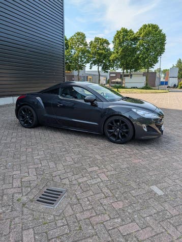 Peugeot RCZ 2011 | Vol Opties | Leder | Cruise | Sportcoupé, Auto's, Euro 5, Zwart, Regensensor, Zwart