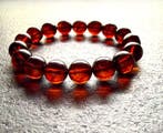Armband met Baltisch amber kralen in kersenkleur. -, Verzamelen, Mineralen en Fossielen