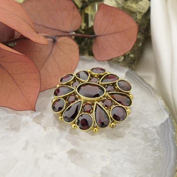 Vintage gouden broche met granaat, Gebruikt, Ophalen of Verzenden, Met edelsteen, Goud