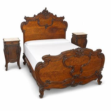 A carved and stained wood three-piece bedroom, comprising