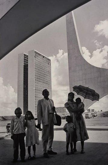 René Burri - Worker from Nordeste shows his family the new
