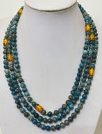 Braziliaanse apatit met een krachtig Tibetaans amulet