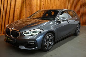 BMW 1-Serie 118i / Stoelverwarming / Navigatiesysteem NR05, Euro 6, Leder en Stof, Benzine, Hatchback