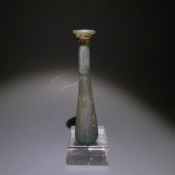 Oud-Romeins Glas Fles. 11 cm hoog. 1e - 2e eeuw na Chr.