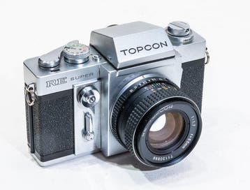Topcon RE Super (read) + RE Topcor 1,7/50mm | Analoge camera, Nieuw