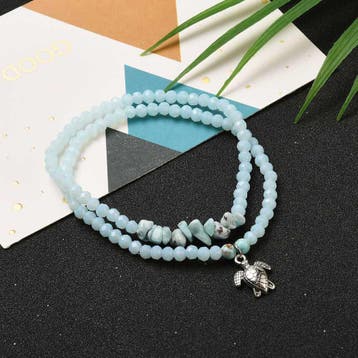 Set van 2 elastische armbandjes met schildpad bedels en L..., Ophalen of Verzenden, Nieuw, Kraal