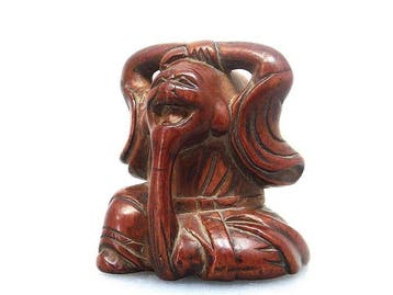 Grappige netsuke van Fukurokuju, een van de zeven goden van