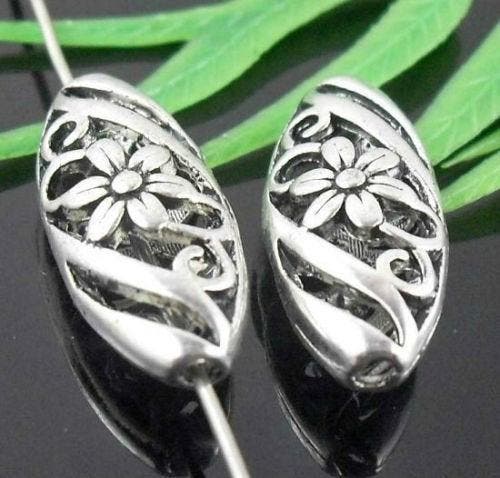 2 x Metalen Bali style kralen ovaal met bloem 23 x 10 x 7..., Hobby en Vrije tijd, Kralen en Sieraden maken, Kraal, Nieuw, Ophalen of Verzenden