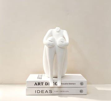 sculptuur, Artistic figurine of a seated figure in a