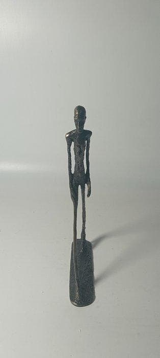 Beeld, Abstract, slender walking figure bronze sculpture in