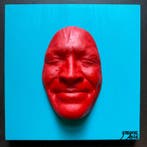 gregos - Red smile on blue light background