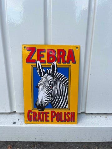 Zebra Grate Polish – kleurrijk emaille reclamebord met zebra