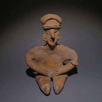 Colima, Westkust van Mexico Terracotta Zittende figuur. 9 cm