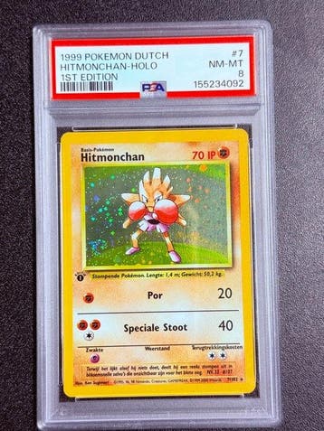 Pokémon - 1 Graded card - Hitmonchan 7/102 Foil, First, Nieuw