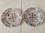 Paar porseleinen borden uit China Imari-decor, XVIIIe-XIXe
