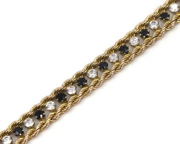 Een 14 krt. geelgouden armband met saffier en zirkonia, Gebruikt