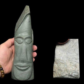 Large serpentine head sculpture in the Pacific style, signed