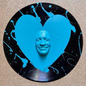 gregos - Blue light smile heart on vinyl record