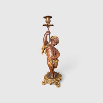 Kandelaber Antique composition metal putti candlestick.