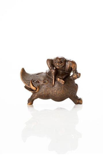 Een zeer ongebruikelijke netsuke van Nitta no Shiro die een