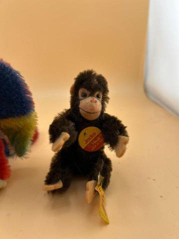 Steiff - Pluche speelgoed Lora (Papagei) und Jocko (Affe) -