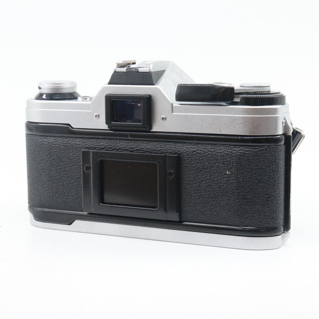 ≥ Canon AE-1 + FD 50mm f/1.8 S.C. — Fotocamera's Digitaal