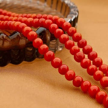 Antiek bloedkoraal kralenarmband met gouden sierslot, Gebruikt, Ophalen of Verzenden, Met edelsteen, Goud