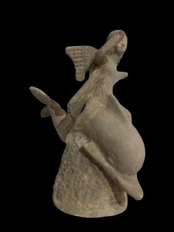 Replica van een Oudgriek Terracotta Eros die een dolfijn