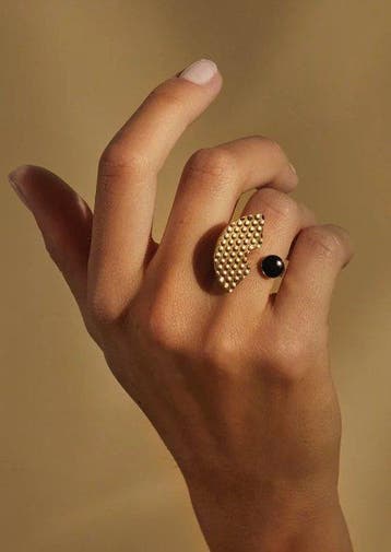 Alessi - staal, gecoat met hypoallergeen PVD, goud en zwart.