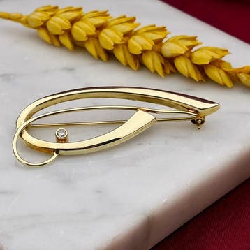 Vintage gouden abstracte broche met zirconia, Gebruikt, Ophalen of Verzenden, Met edelsteen, Goud