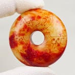 Uitgebeitelde stenen Bi-schijf (Bi Disk) met diermotieven —